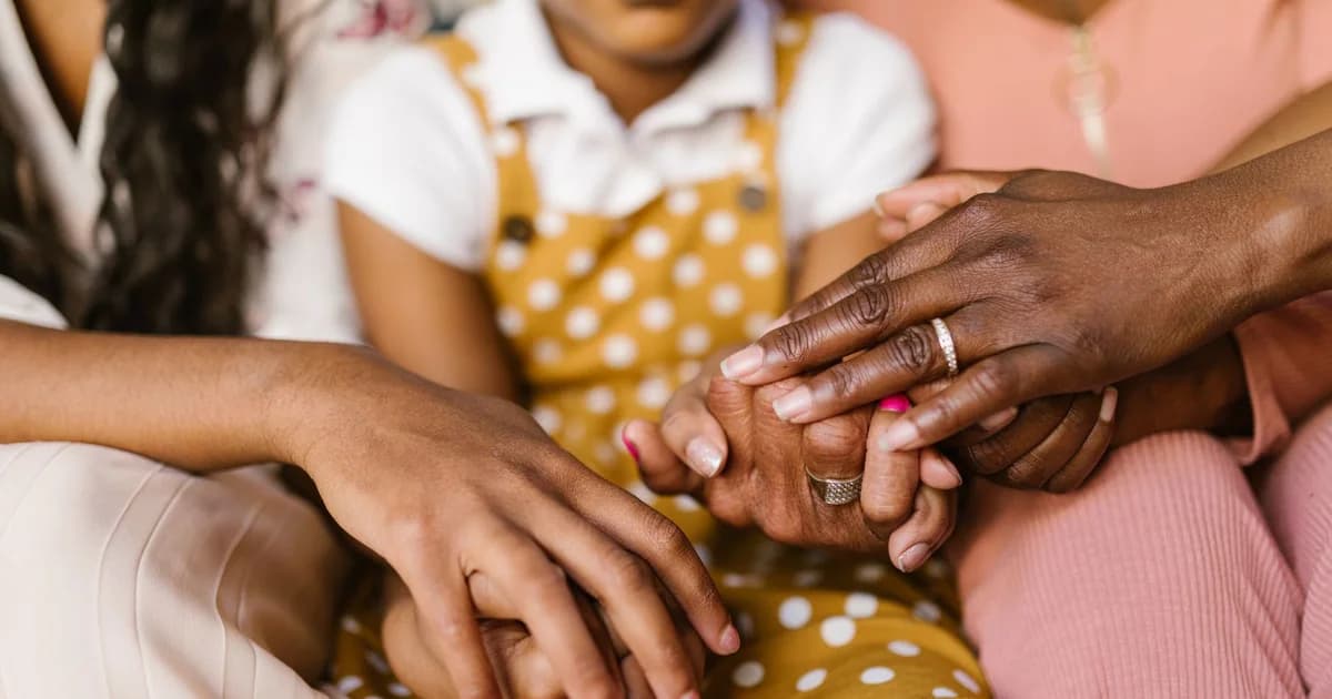 A close-up view of loving family hands holding together, symbolizing unity and support.