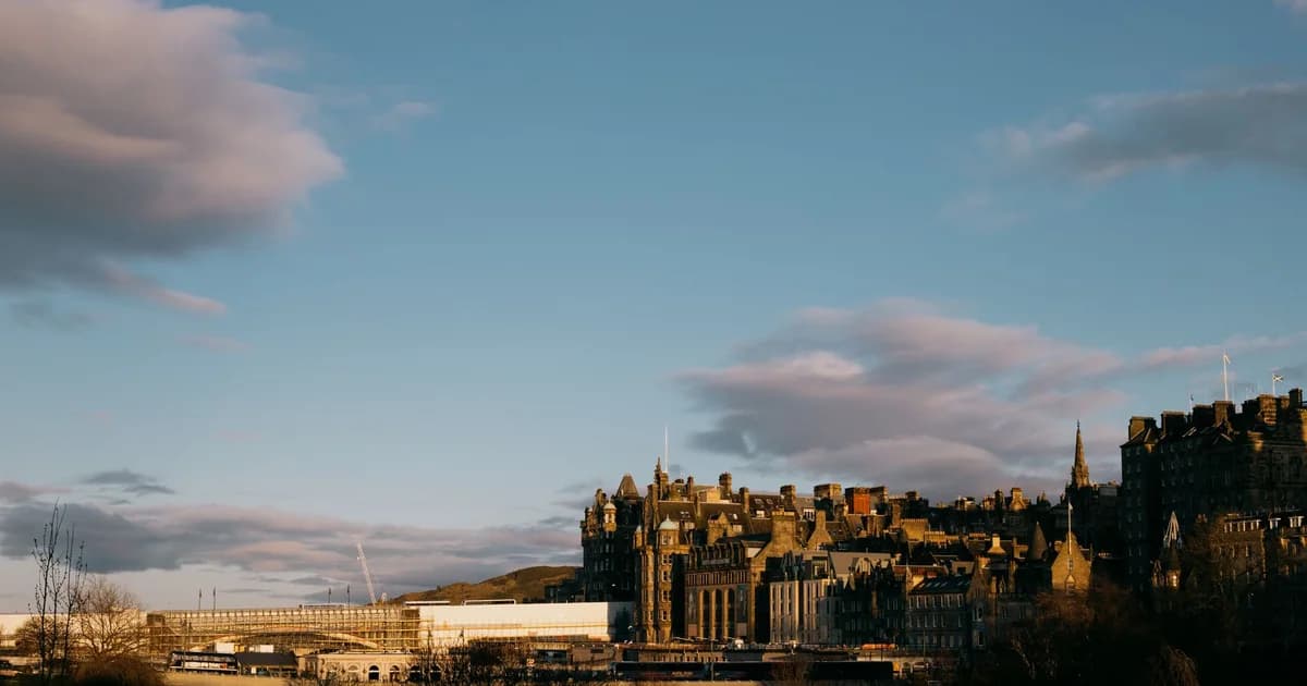 View of Edinburgh's historic architecture against a stunning sunset sky.