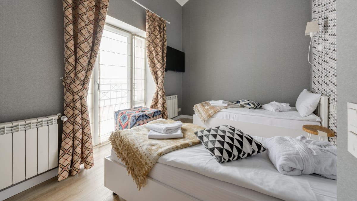 A tidy furnished spare bedroom with fresh linen, prepared for a short-stay guest in a UK home